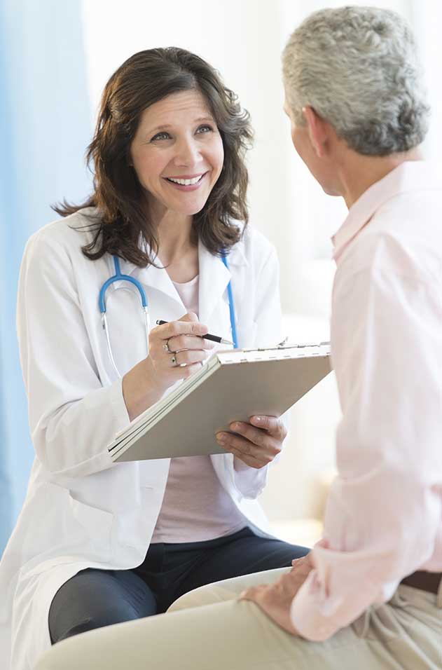doctor filling out a medicare form with a patient